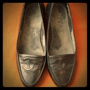 Chanel black leather loafers with embossed emblem